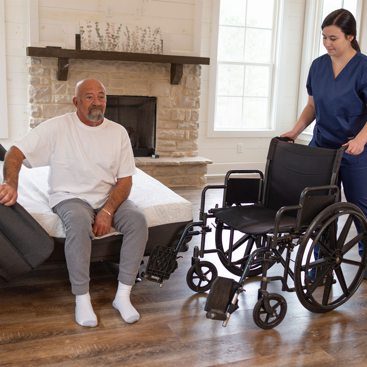 Flex-A-Bed Hi-Low SL lowered to wheelchair height for a safe transfer
