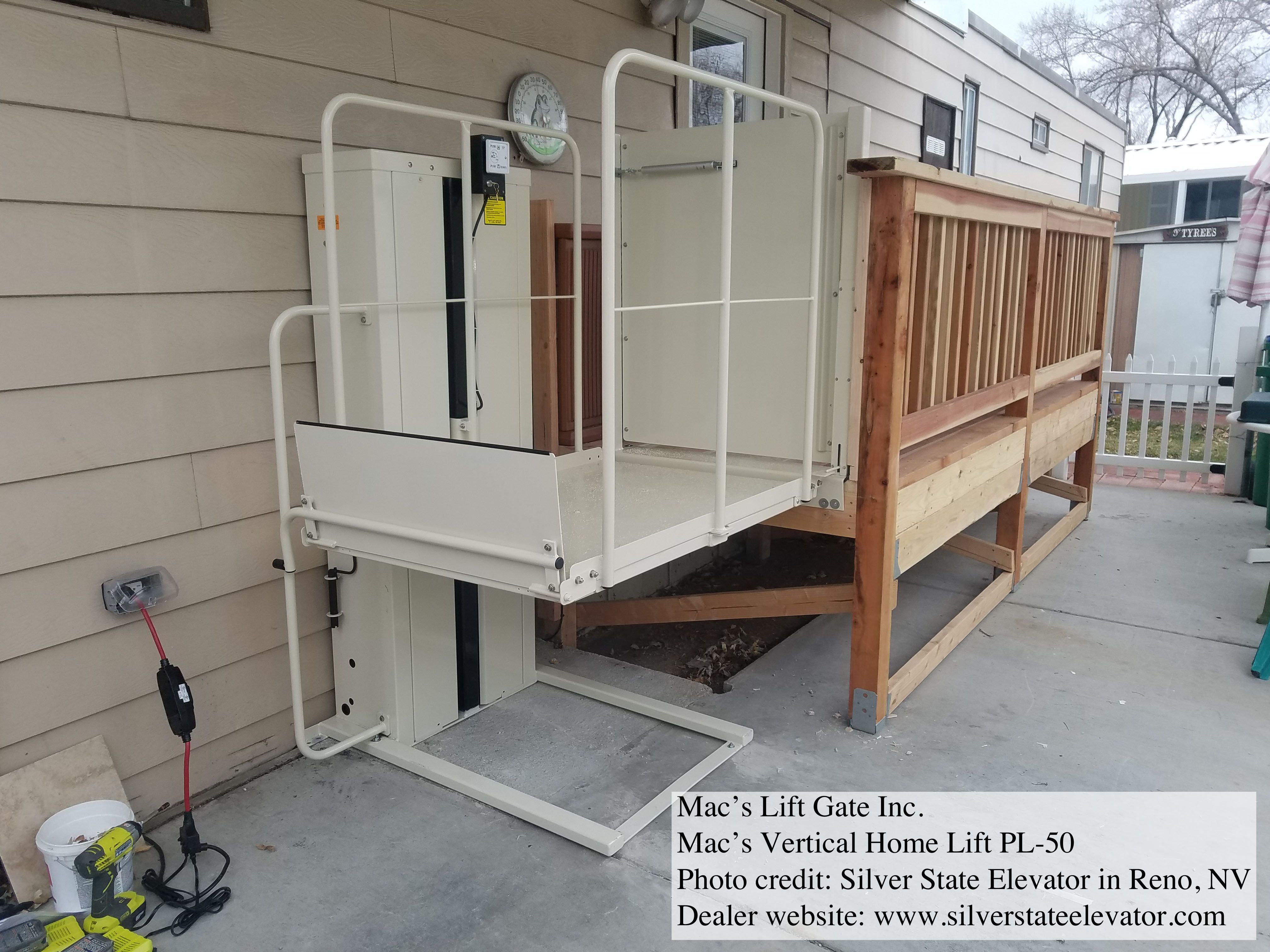 MACS PL50 vertical platform lift installed beside a residential deck